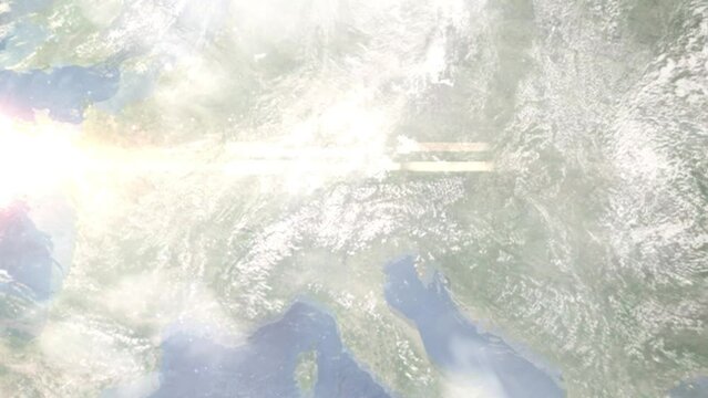 Earth zoom in from outer space to city. Zooming on Telfs, Austria. The animation continues by zoom out through clouds and atmosphere into space. Images from NASA