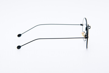 Fashion sunglasses round shape and black frames on white background.