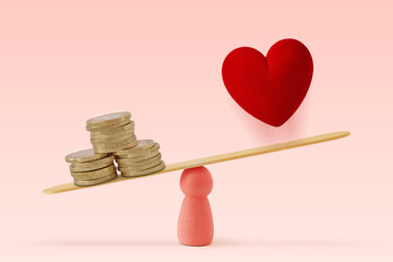 Money and heart on scale on pink background- Concept of woman and money priority over love in life