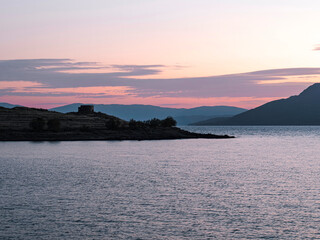 Sunset over Saronic gulf sea, Perdika village, Aegina, Greece.