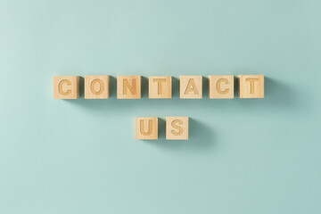 CONTACT US sign on wooden cubes