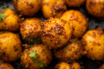 Homemade Roasted Bombay potatoes. Pan fried little baby potatoes or aloo with jeera seeds and...