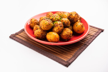 Homemade Roasted Bombay potatoes. Pan fried little baby potatoes or aloo with jeera seeds and coriander in bowl