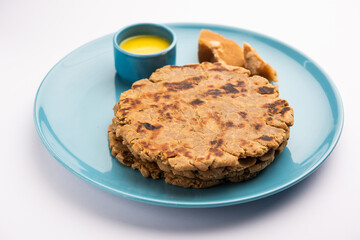 Sweet roti made out of rice flour, jaggery, and ghee. Gud ki roti. gur ki roti, jaggery Bhakri, meethi gud ki roti. Winter food. Copy space.
