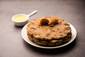 Sweet roti made out of rice flour, jaggery, and ghee. Gud ki roti. gur ki roti, jaggery Bhakri, meethi gud ki roti. Winter food. Copy space.