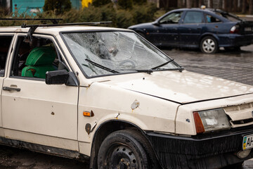 Irpin, Kyev region Ukraine - 09.04.2022: Shot cars. On the streets of Irpin. Cities of Ukraine after the Russian occupation. Irpin, Bucha, Hostomel.