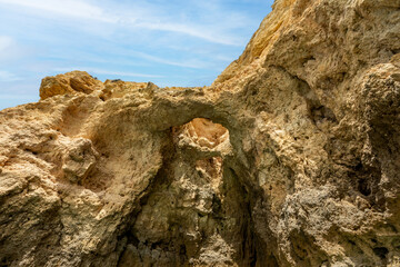Panoramic view, Ponta da Piedade Lagos in Algarve, Portugal. Cliff rocks,  and tourist boat on sea and caves at Ponta da Piedade, Algarve region, Portugal.