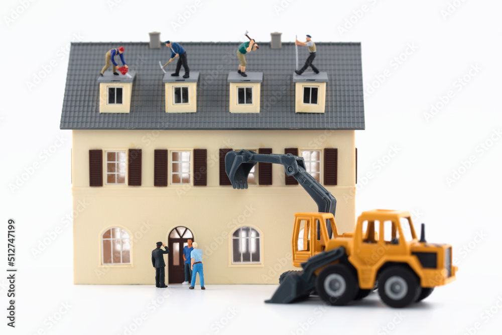 Wall mural Miniature scene house demolition on white background