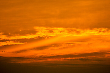 sun ray is go down and amazing dramatic orange cloud