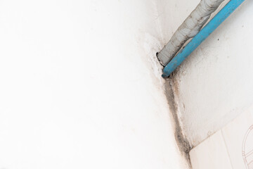 Water damaged ceiling roof in an old house. Water damage building interior. Ceiling house broken. Ceiling concrete crack and exposed the rusty steel bar frame.