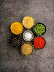 High quality photo of various spices with a dramatic concept on a dark background.