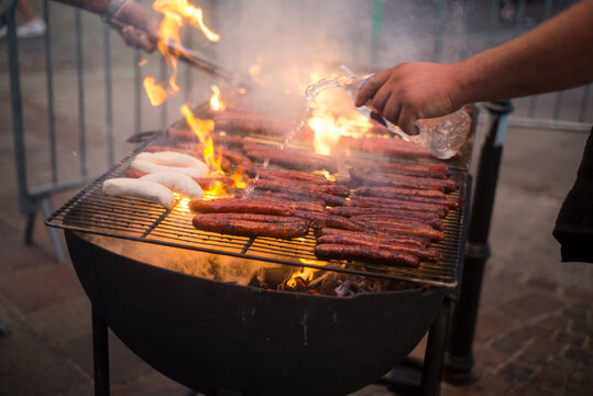 Closeup of saussage merguez on barbecue in  the street