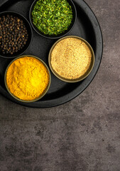 High quality close up photo of various spices with a dramatic concept.