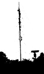 silhouette of a high signal link tower or often called "Base Transceiver Station" and a small solar cell tower