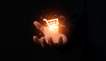 Hand holding virtual info graphics with trolley cart icons , Technology online shopping business...