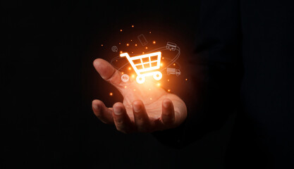 Hand holding virtual info graphics with trolley cart icons , Technology online shopping business concept.