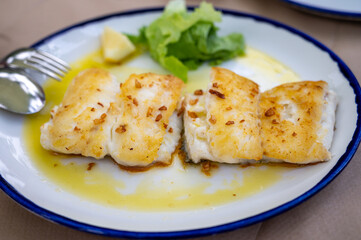Grilled fillet of white codfish served in fish restaurant in San Sebastian, Basque Country, Spain