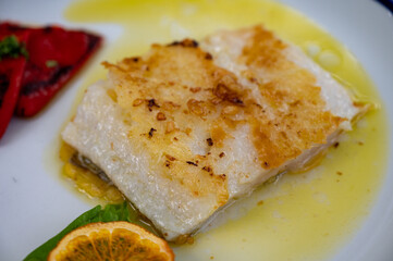 Grilled fillet of white sea bass served in fish restaurant in San Sebastian, Basque Country, Spain