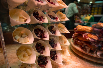 Spanish street food, fresh cutted cheese, jamon ham, choriso sausage ready to eat