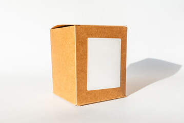 Closed brown cardboard box on a white background.White blank space for text.