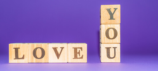 i love you text on wooden blocks purple veri peri background.copy space.Banner.
