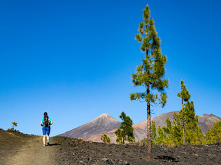 man hiking towards the volcano in El Teide national park  Tenerife