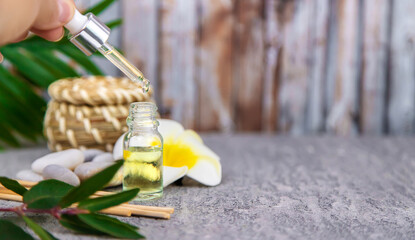 Background spa cosmetics and oils and herbs. Selective focus.