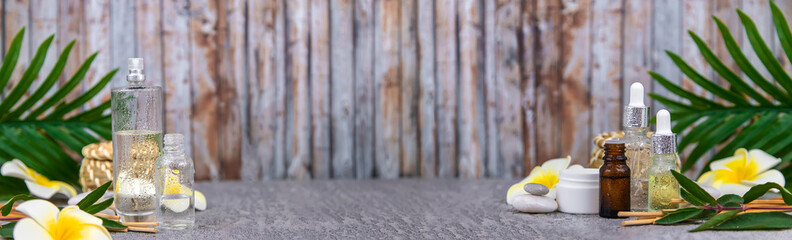 Background spa cosmetics and oils and herbs. Selective focus.