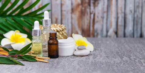 Background spa cosmetics and oils and herbs. Selective focus.
