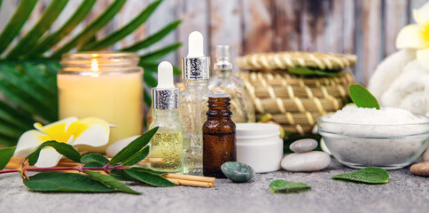 Background spa cosmetics and oils and herbs. Selective focus.