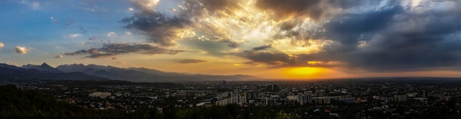 amazing view of the city of almaty with mountain view at sunset from the observation deck on Mount...