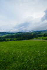 Austria, land of Styria. Beautiful mountain landscape in a mountain village after rain. The beautiful nature of Austria, the road in the mountains.