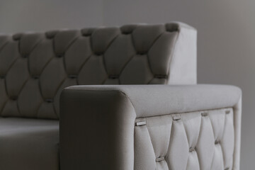 gray sofa with eco-leather on a gray background