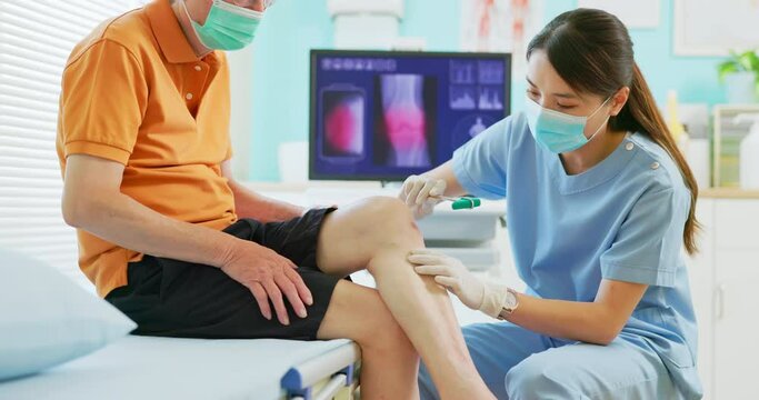 doctor examining patient knee