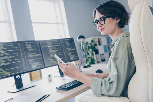 Photo of positive attractive lady sitting chair hold use telephone typing chatting workplace office