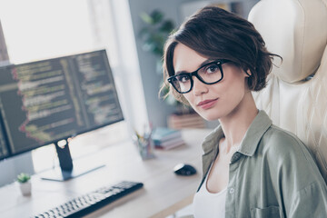 Photo of intelligent young lady programmer experienced service administrator working remote in office