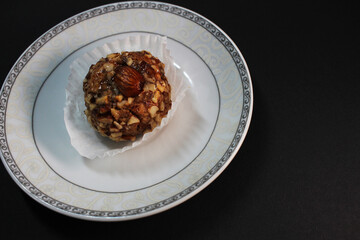 oriental sweets on a white plate black background