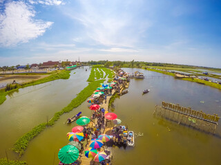 Saphan Khong Floating Market,Song Phi Nong District,Suphanburi,Thailand on December 15,2018:Bird's-eye view of the market seen from giant fish trap viewpoint.