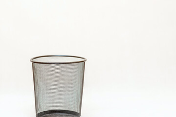 Empty mesh trash bin, garbage can on a white background.