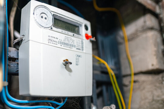 Smart electric power meter counter measuring power usage.Close-up of modern smart grid residential digital power supply meter.Indoors shot.Selective focus.
