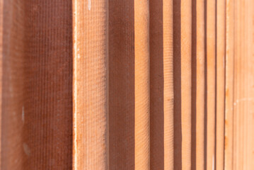 Corrugated red asbestos roof.A fragment of a roof background.