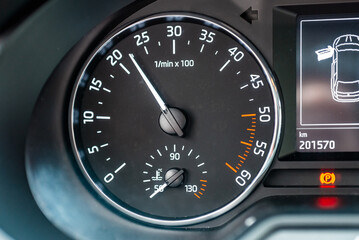 Modern car speedometer,odometer,tachometer and illuminated dashboard. car dashboard modern automobile controlilluminated panel speed display.Car instrument panel.Close up.Selective focus.
