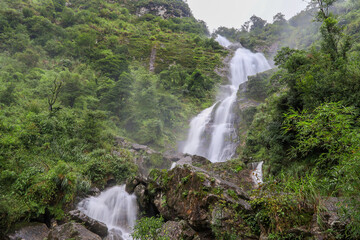 Fototapeta na wymiar Beautiful scenery and fresh cool atmosphere at Silver Waterfall (Thac Bac waterfall) in Sapa,Lao Cai province,North Vietnam.
