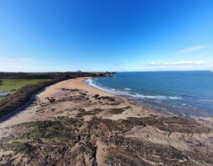 Fototapeta na wymiar Aerial view of the sea and rocky coastline on the East coast of Scotland. 