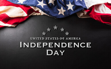Happy Independence day concept made from American flag and the text on dark wooden background.