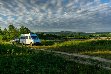 camper parking next to lake