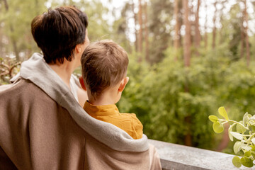 Happy grandmother and grandson enjoy time together. Positive middle age woman spending time with little, cute grandchild, having fun. 50-year-old grandma with grandkid. Multi-generational family.