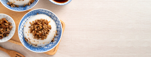 Taiwanese savory rice pudding Wa gui with chopped dried radish and soy sauce
