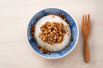 Taiwanese savory rice pudding Wa gui with chopped dried radish and soy sauce