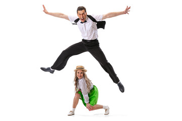 Fototapeta na wymiar Excited young man and woman dancing, jumping, having fun isolated on white background. Art, music, fashion, style concept
